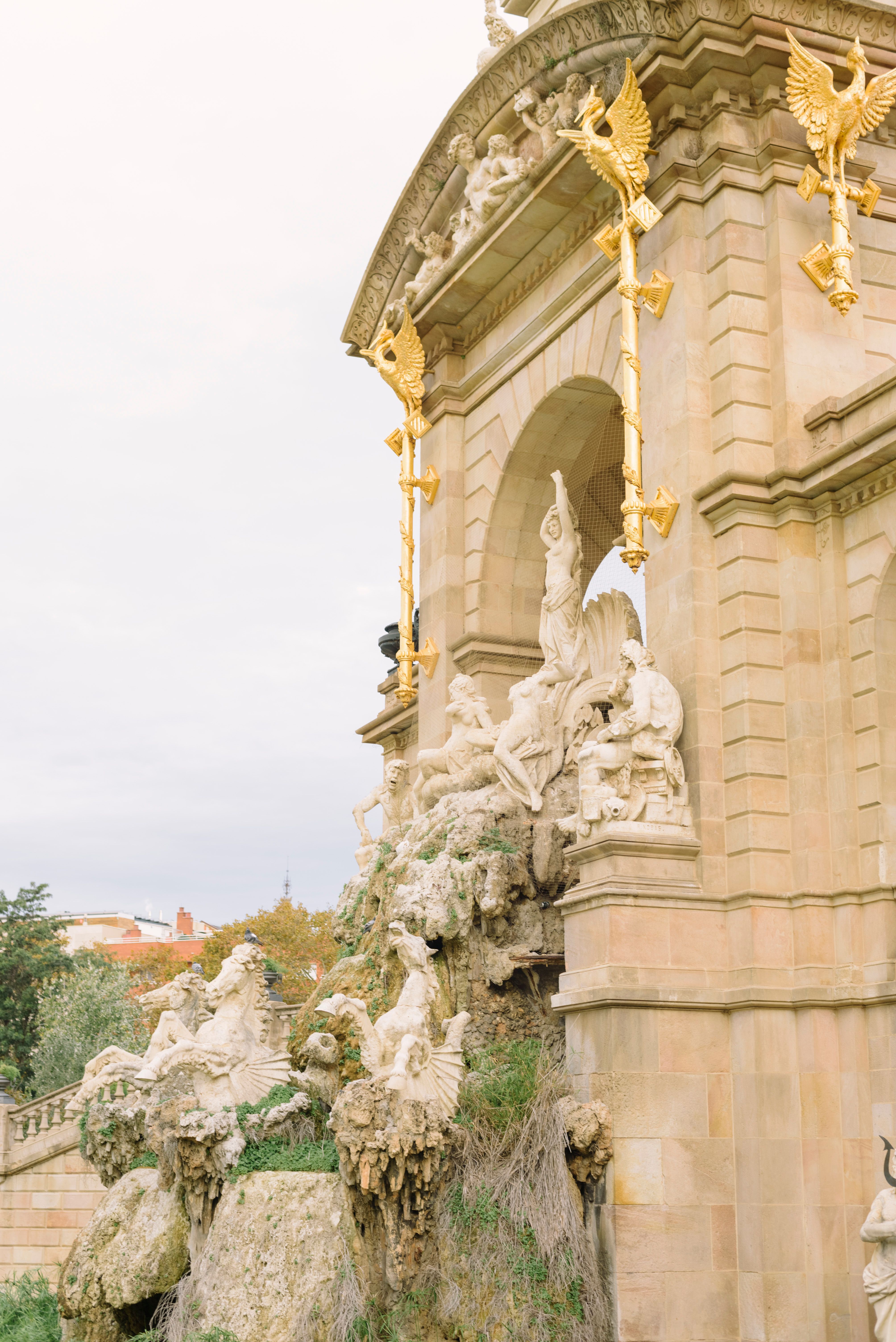 Ornate Fountain Structure with Golden Accents · Free Stock Photo
