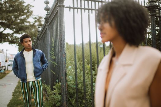 Stylish black couple showcasing modern street fashion in New York City.