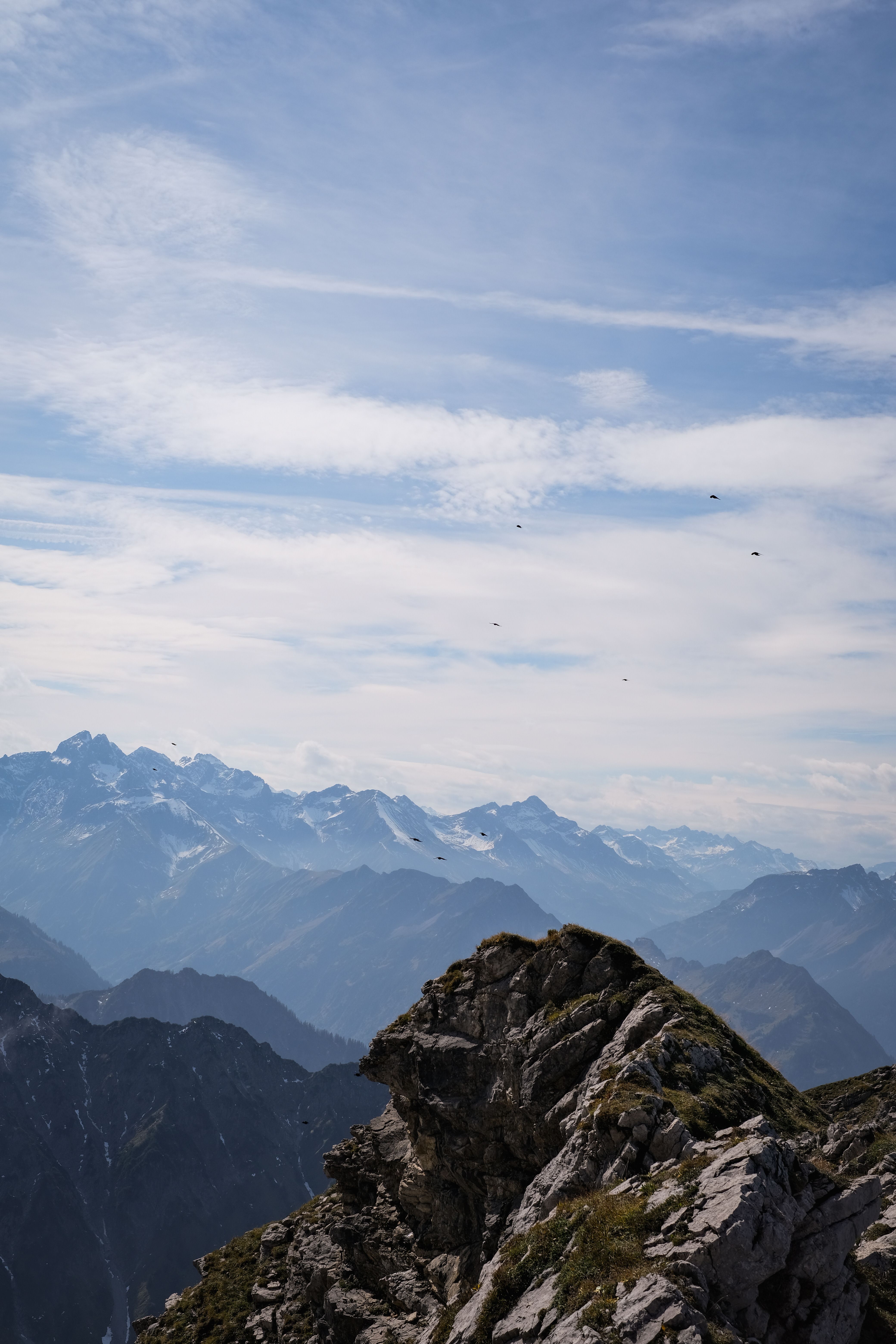 Majestic mountain peaks under clear blue sky · Free Stock Photo