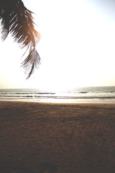 Experience tranquility with a stunning tropical sunset at Udupi beach in Karnataka, India.