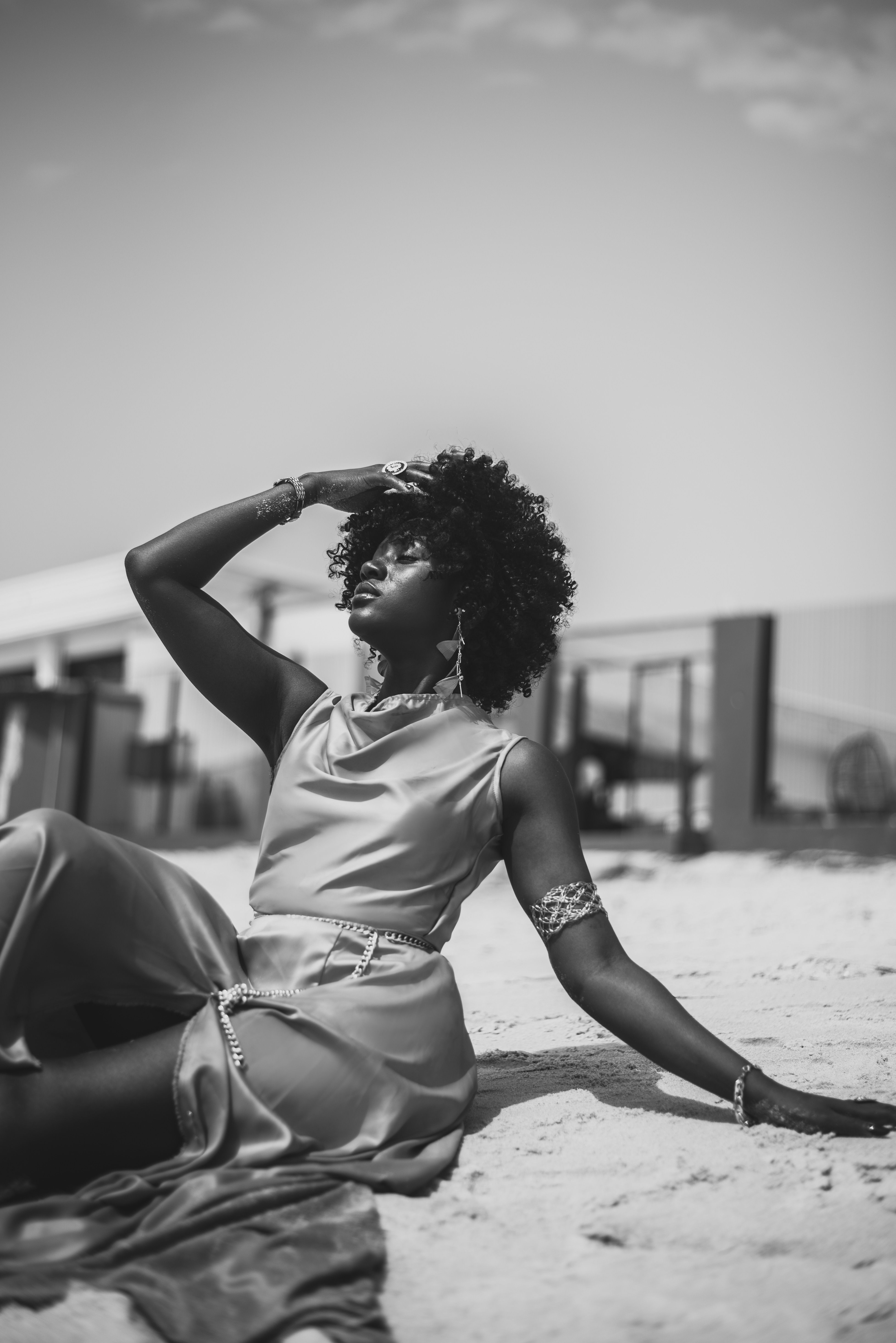 Black and White Beach Portrait of Woman Relaxing · Free Stock Photo