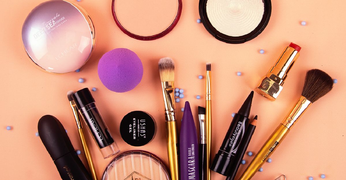 Flat lay of makeup products and cosmetics tools arranged for fulfilment and packing
