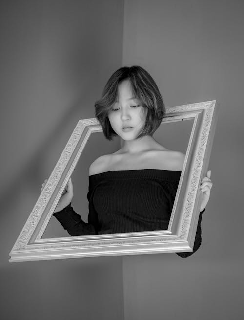 Photo Of Woman Holding Frame