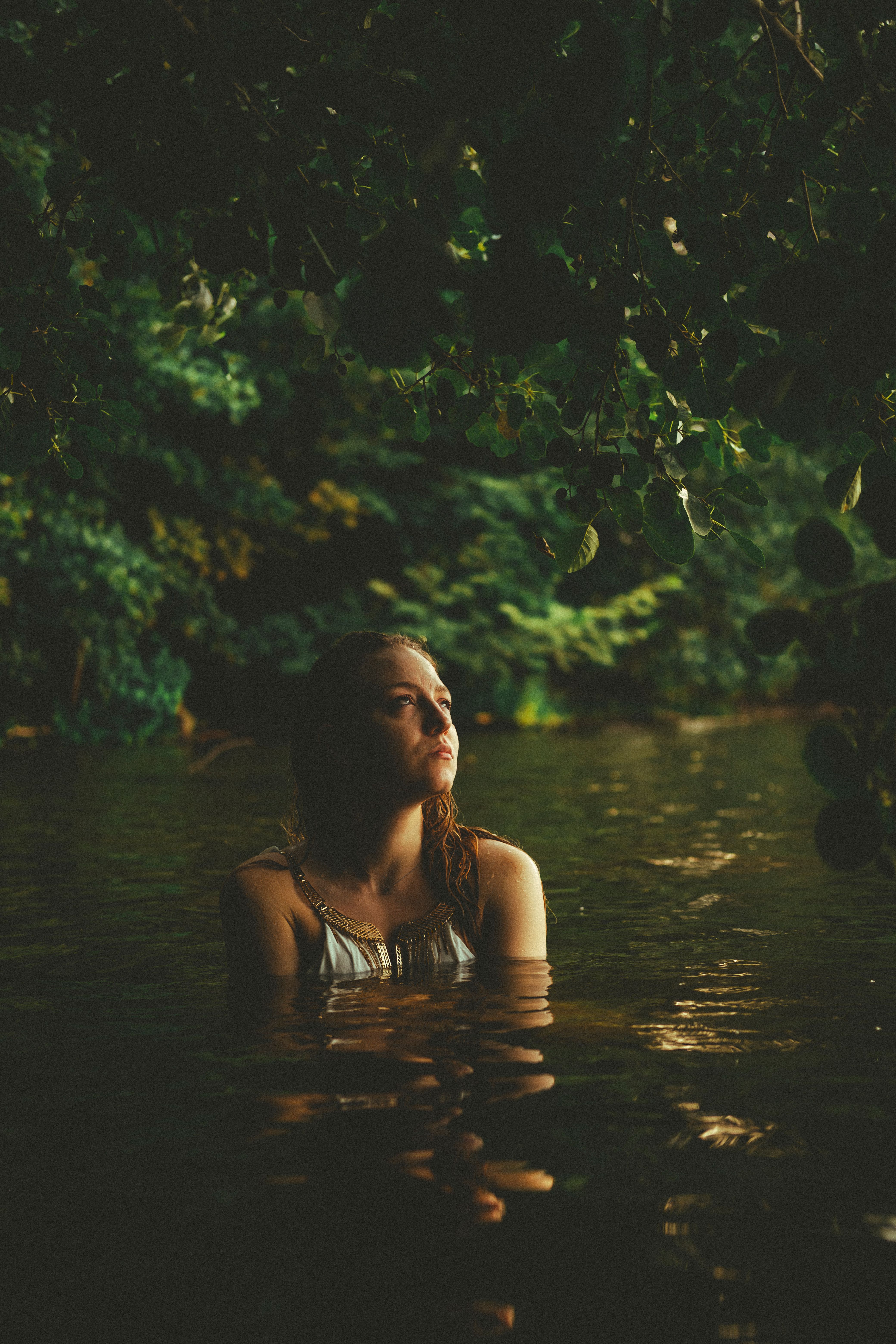 Serene Woman in Lake Surrounded by Nature · Free Stock Photo