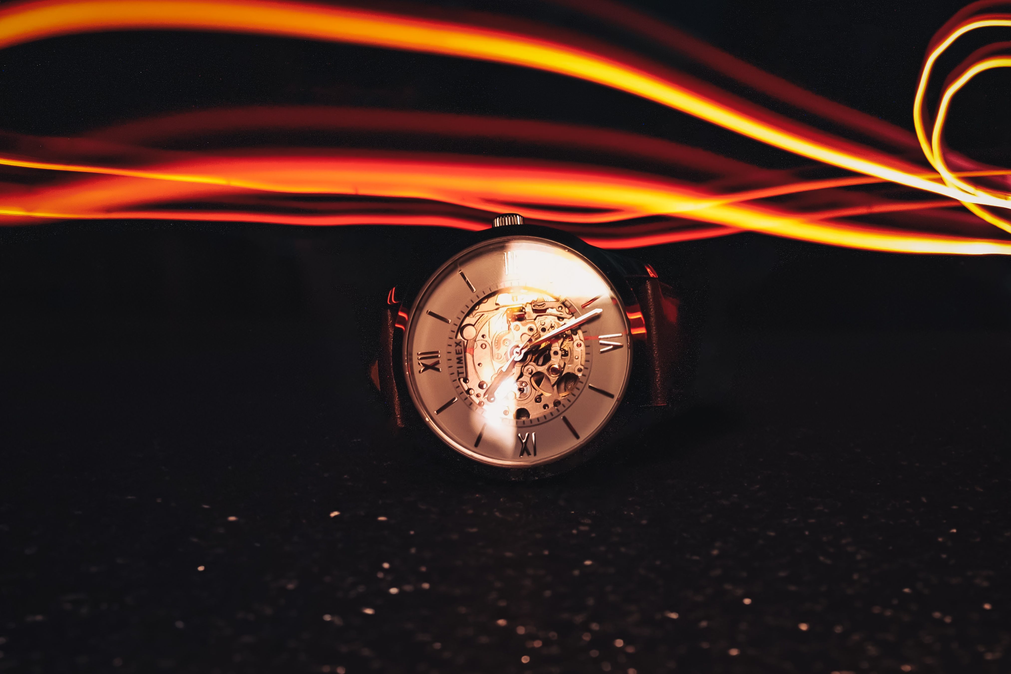Elegant Watch with Light Trails in Dark Setting · Free Stock Photo