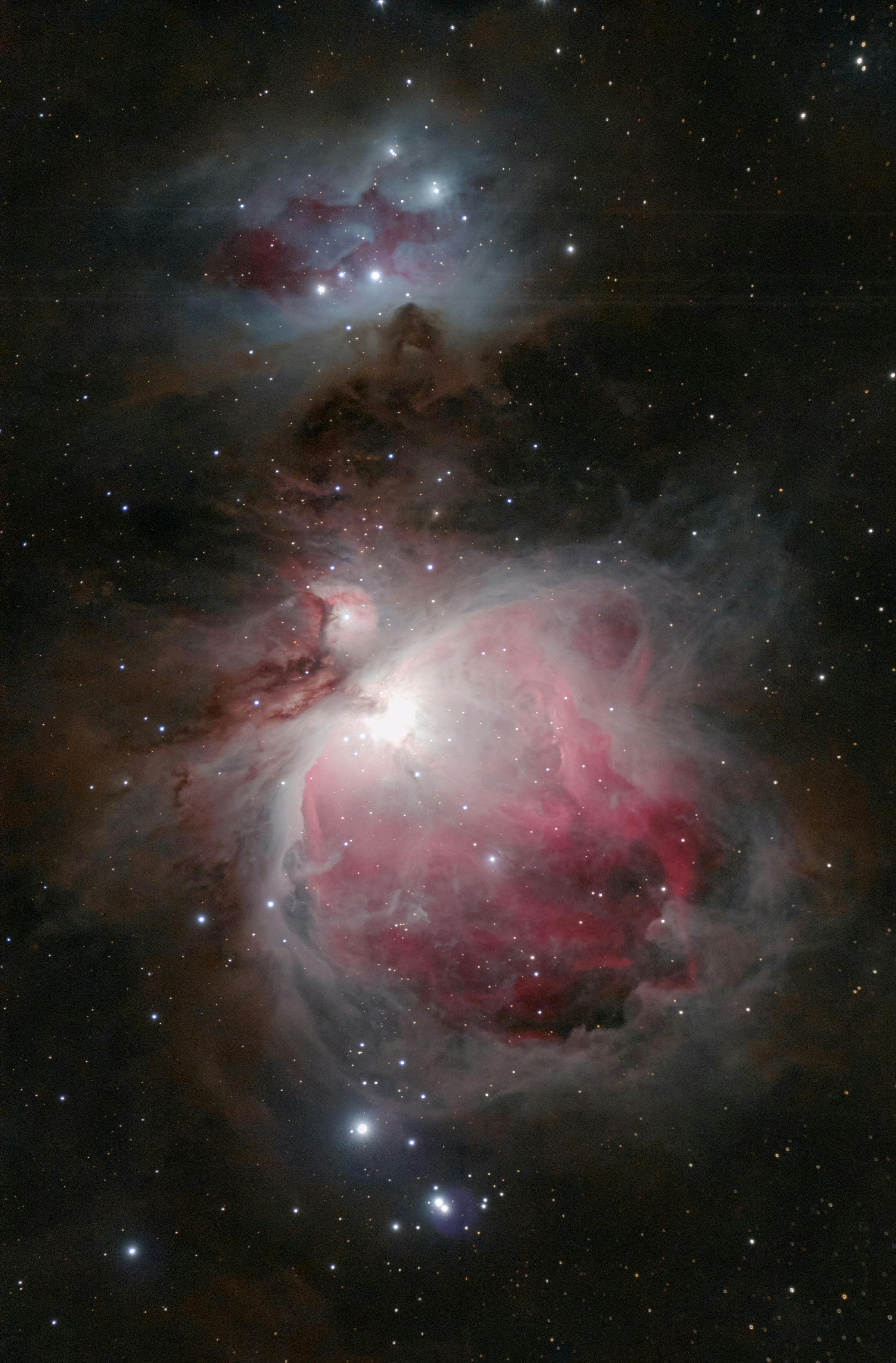 Breathtaking view of the Orion Nebula with swirling clouds and vibrant stars.