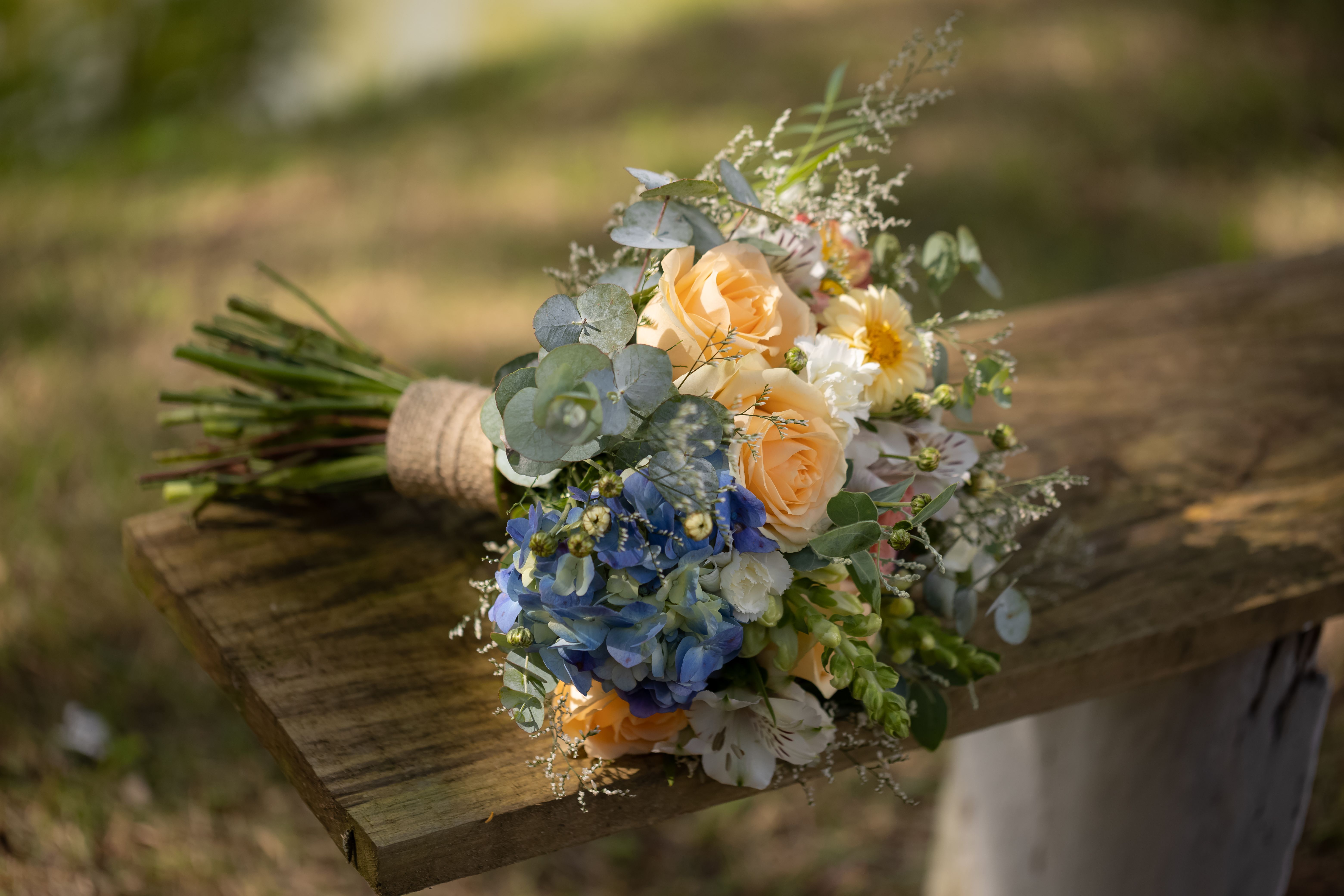 A loosely hand-tied garden-style bouquet with lush greenery