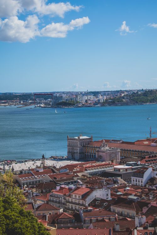 Free Breathtaking aerial view of Lisbon, showcasing the Alfama district and Tagus River. Stock Photo