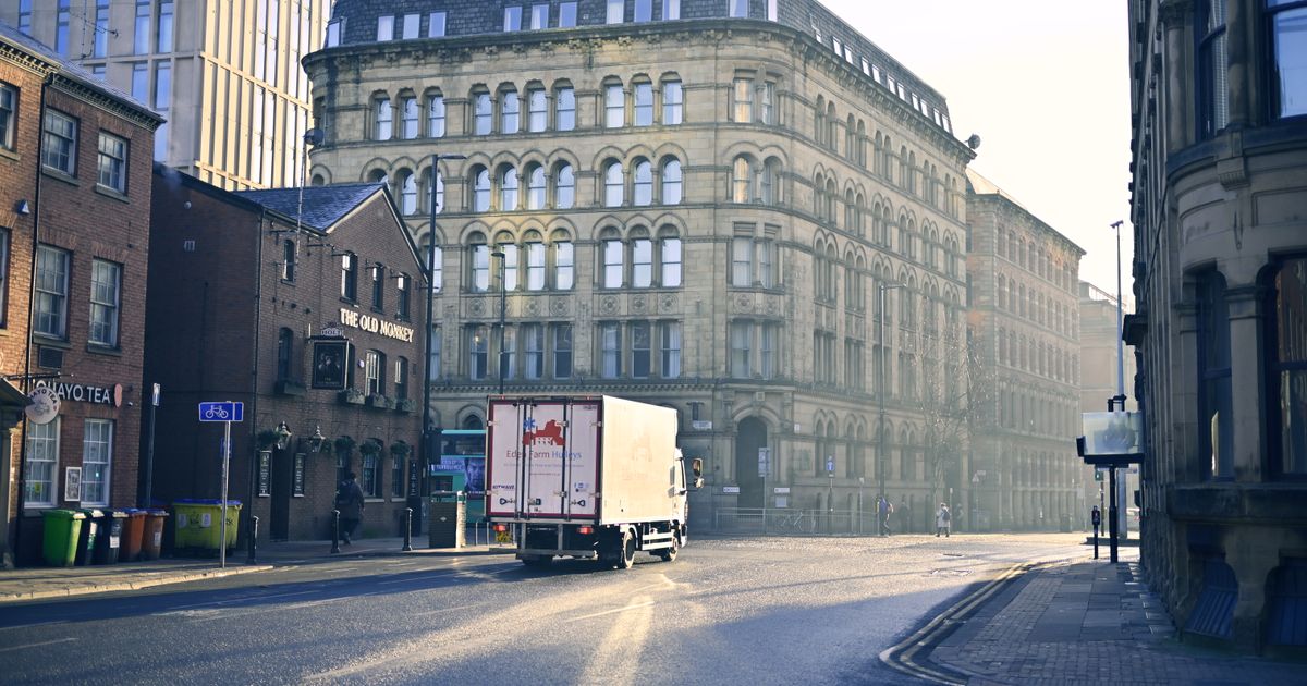 No Win No Fee Solicitors in Manchester: How Conditional Fee Agreements Work — A quiet urban street scene with historic architecture in early morning light.
