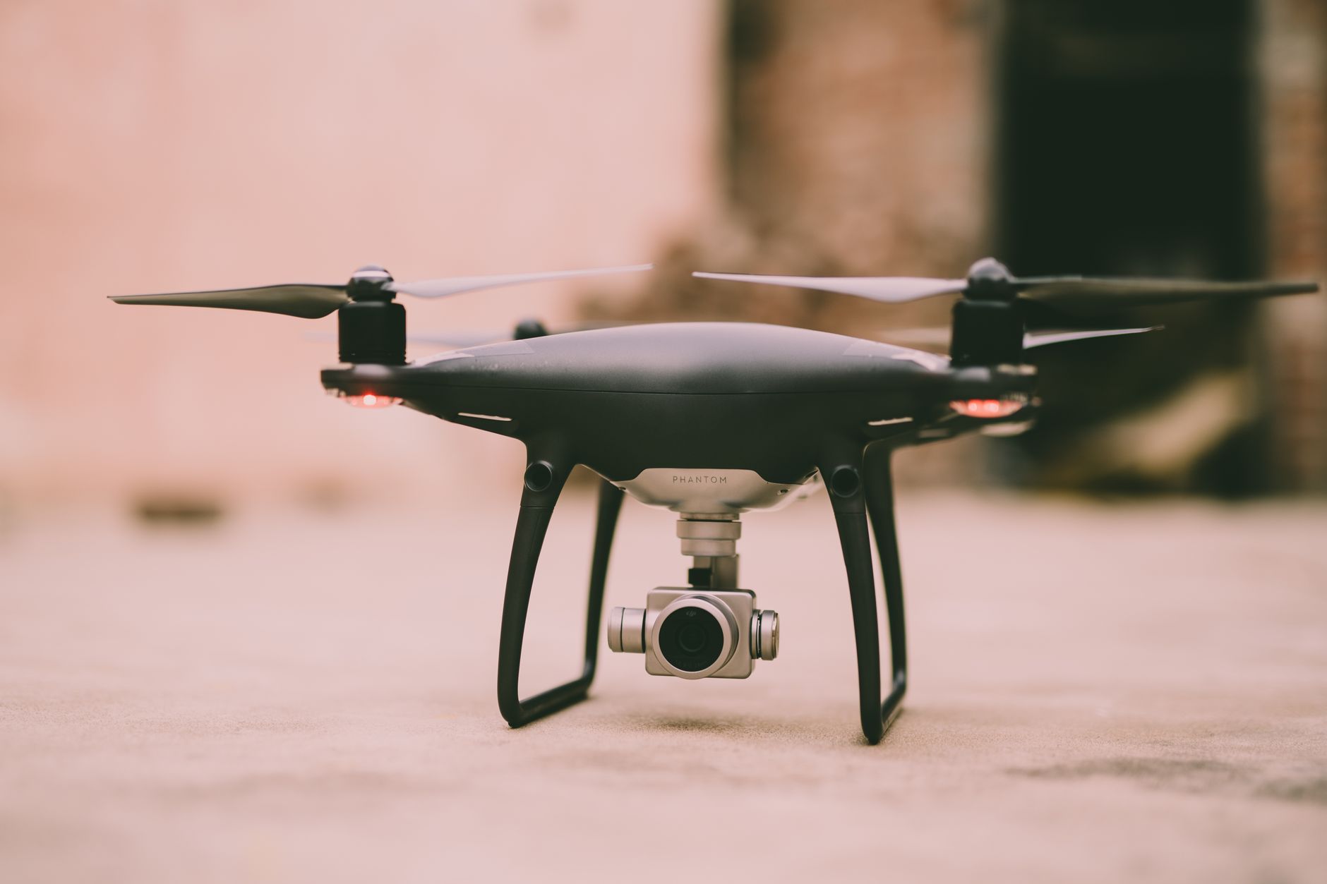 A detailed view of a Phantom drone with camera ready for flight outdoors.