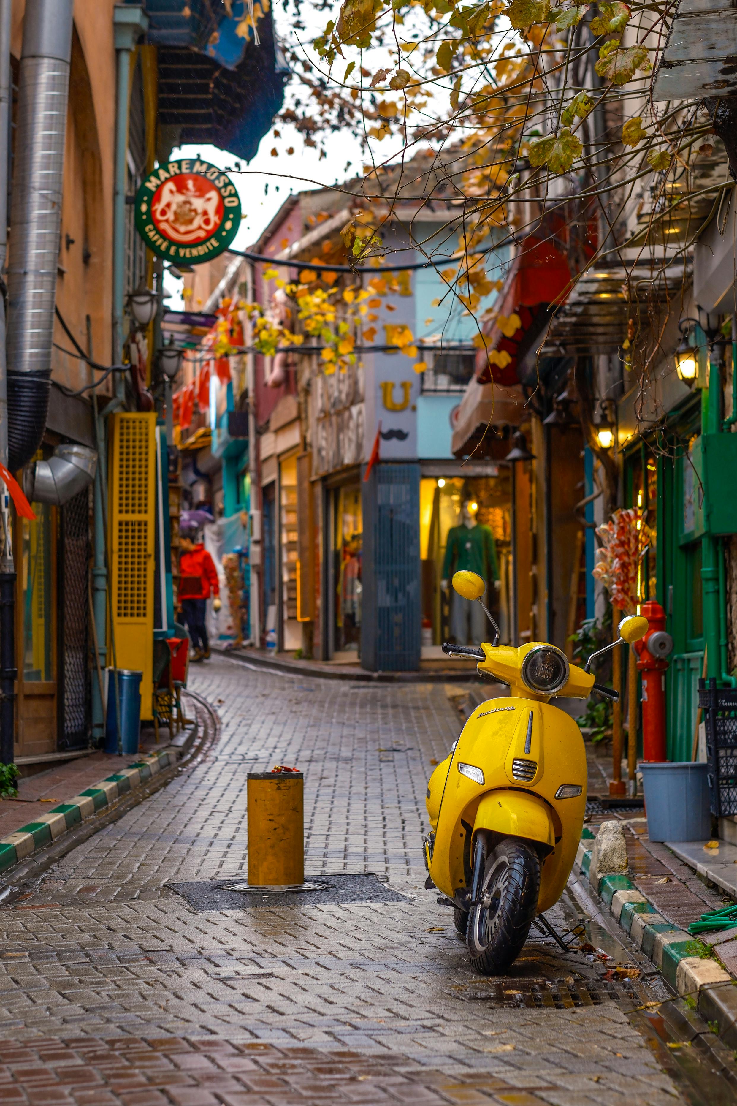 colorful backstreet in istanbul with yellow scooter