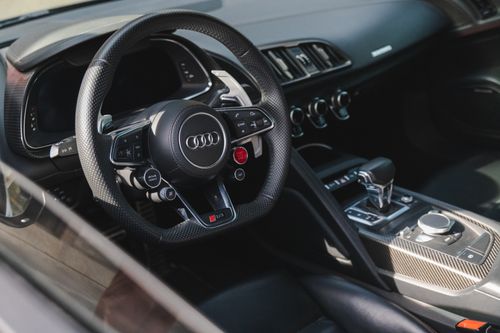 Free High-resolution image showcasing the sleek interior of a luxury Audi car, focusing on the steering wheel and dashboard. Stock Photo