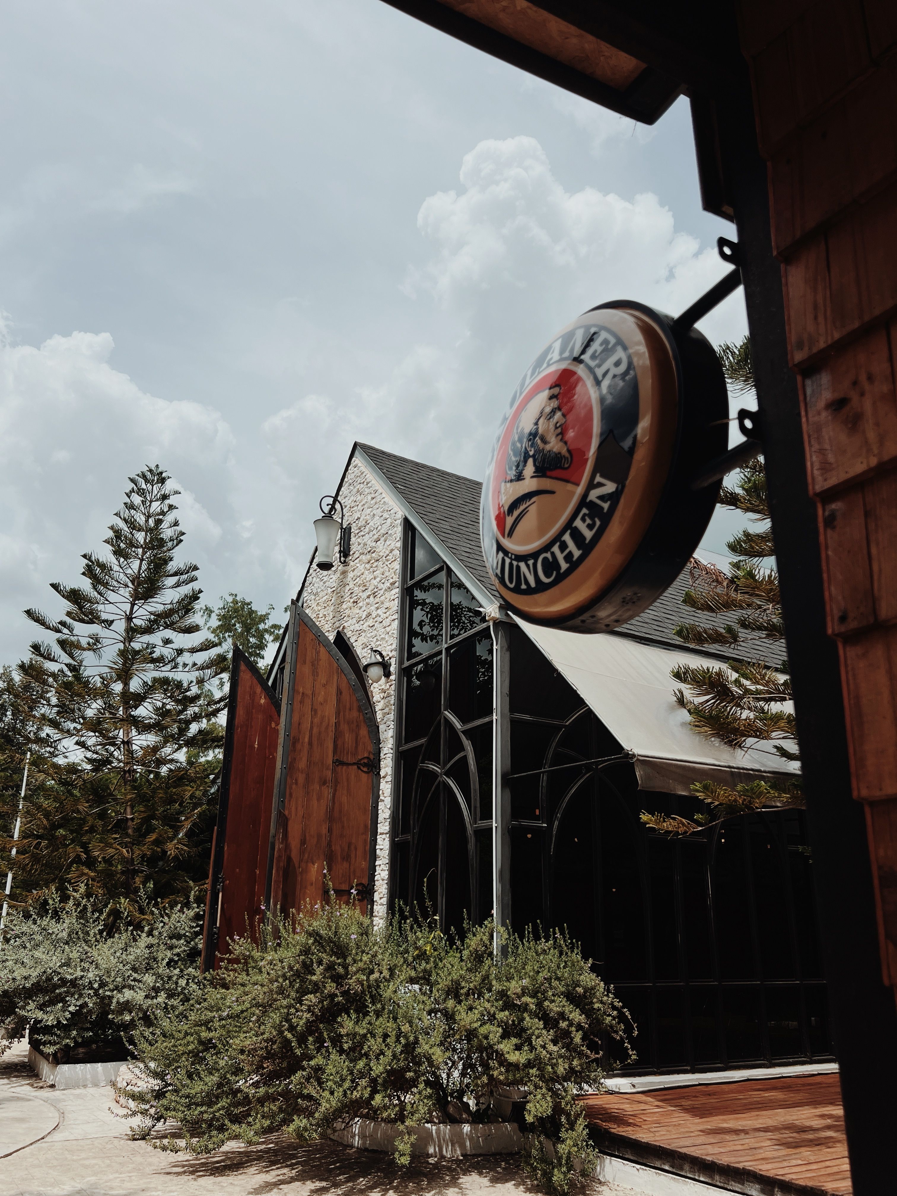 Rustic Bavarian Brewery with Signage Outdoors · Free Stock Photo