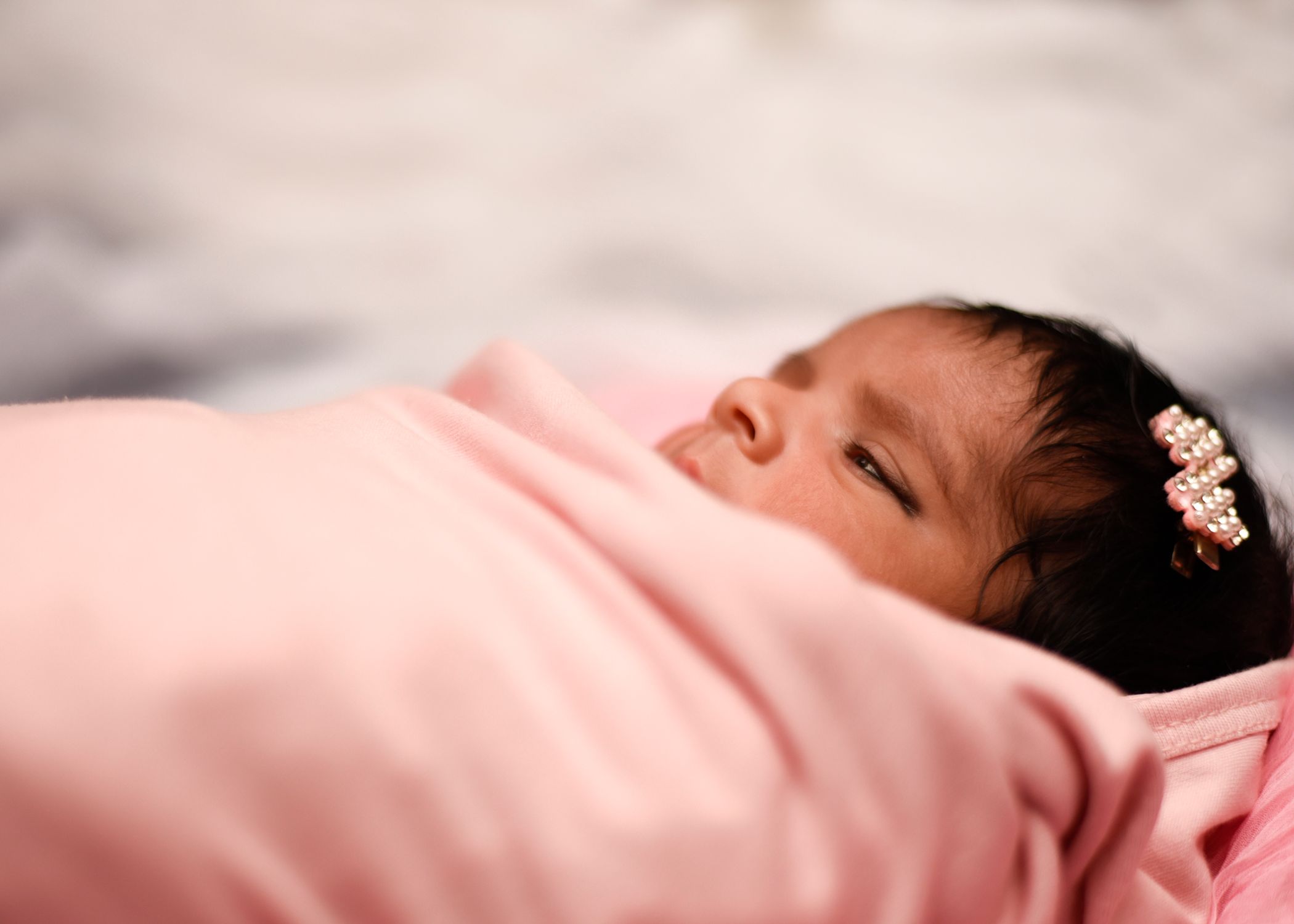 Heartwarming Baby Wrapped in Soft Pink Blanket · Free Stock Photo