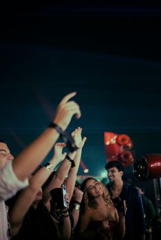 Energetic nightlife vibes captured in a bustling night club full of dancing and joy.
