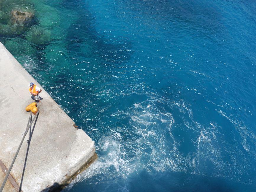 a professional marine surveyor inspecting a mid-sized yacht hull - boat surveyor cost