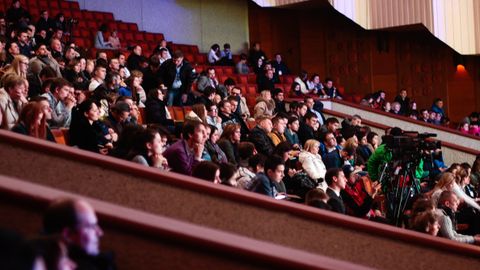 Engaged audience seated indoors, captured with a Canon camera. Ideal for event coverage visuals.