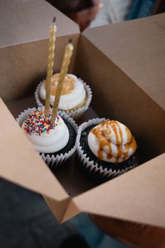 A box of gourmet cupcakes, ideal for birthdays or celebrations.