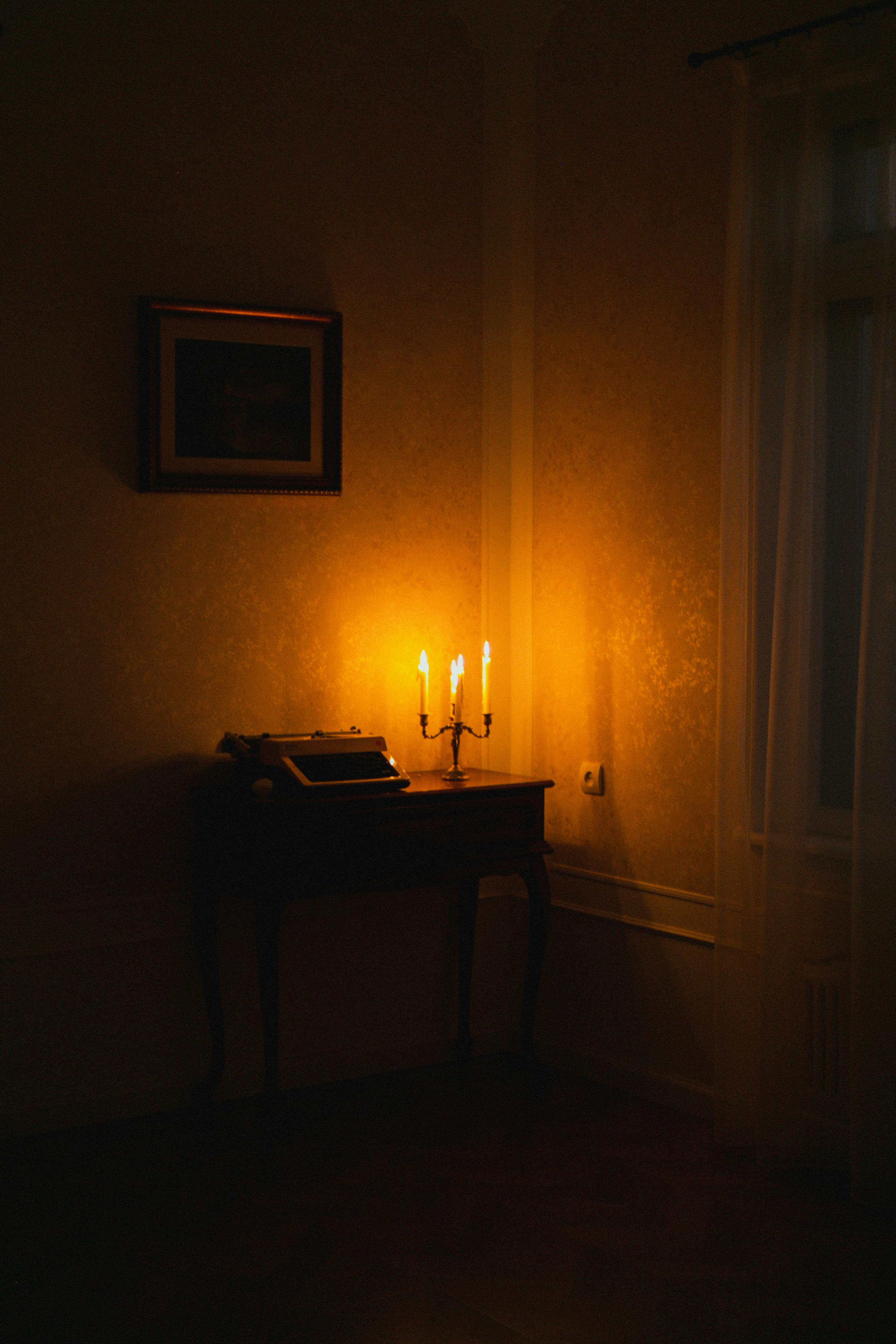 Warm and nostalgic candlelit scene in a vintage-styled room provides a cozy atmosphere.