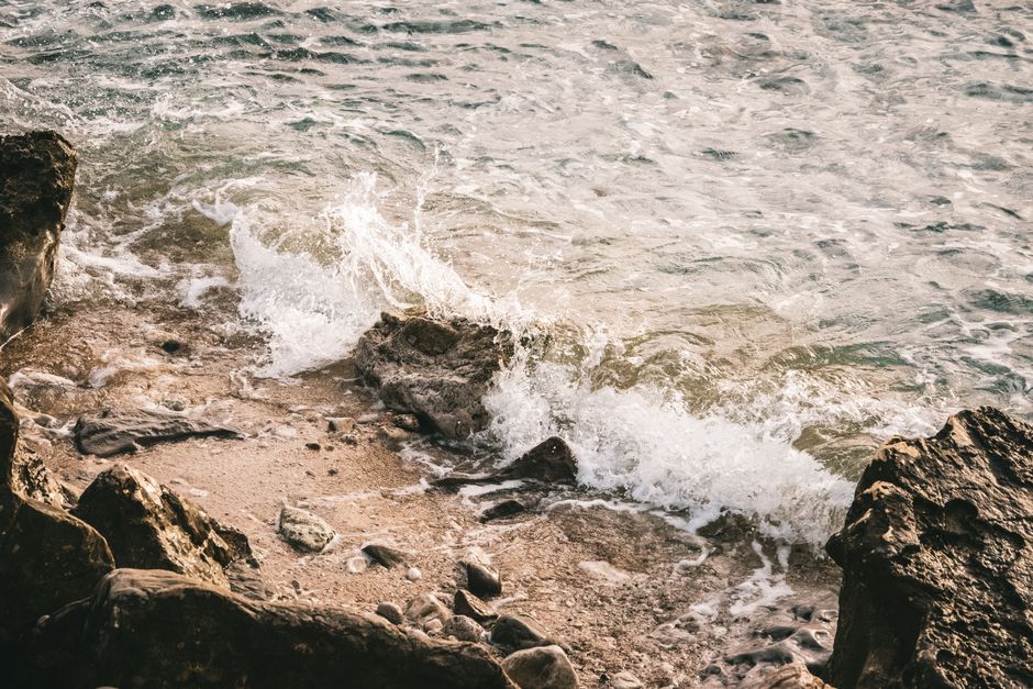 Waves crashing on a rocky shoreline, showcasing natural coastal beauty.