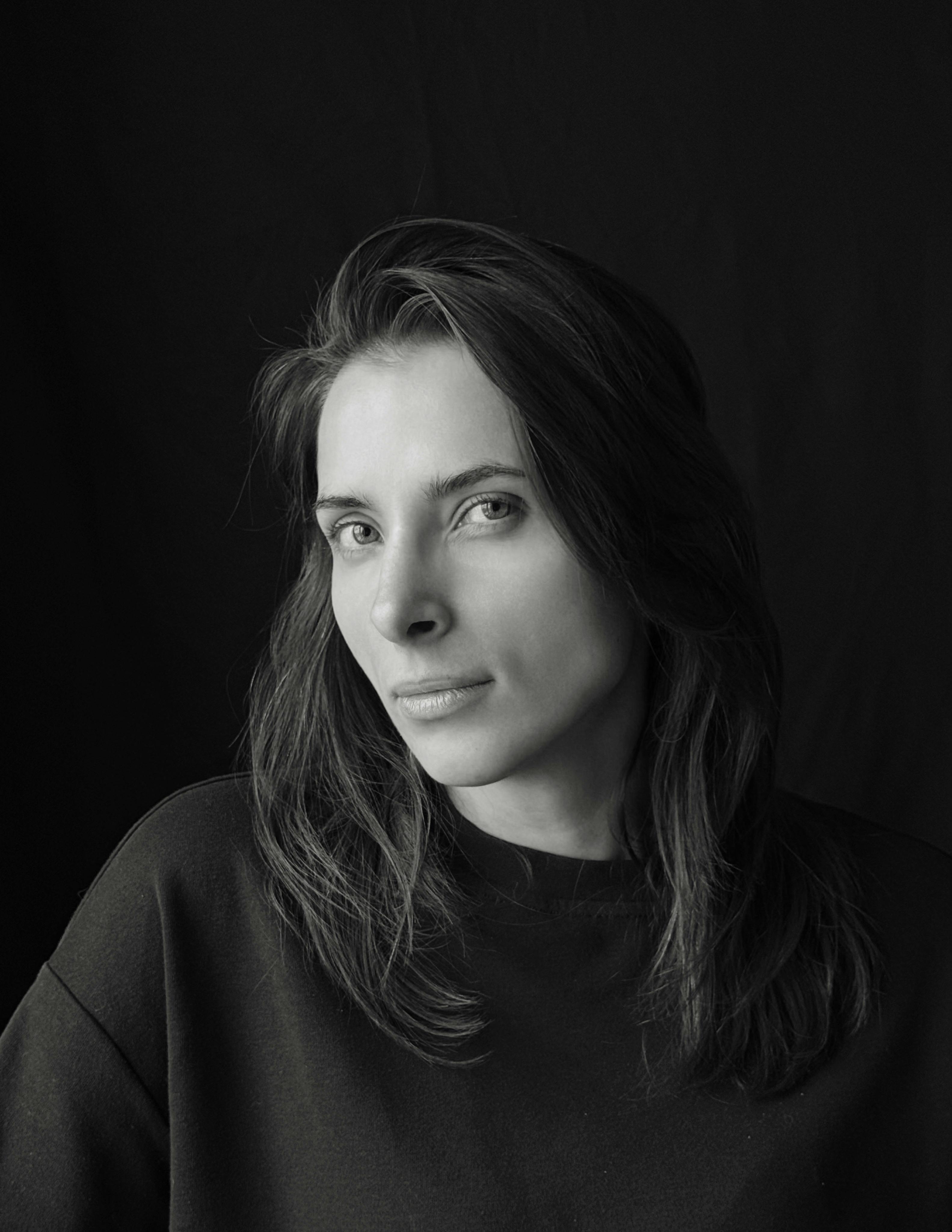 Elegant black and white portrait of an adult woman with a thoughtful expression.