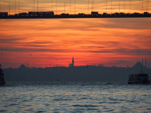 Free Stunning view of the Bosphorus at sunset with Istanbul skyline and bridge silhouette. Stock Photo