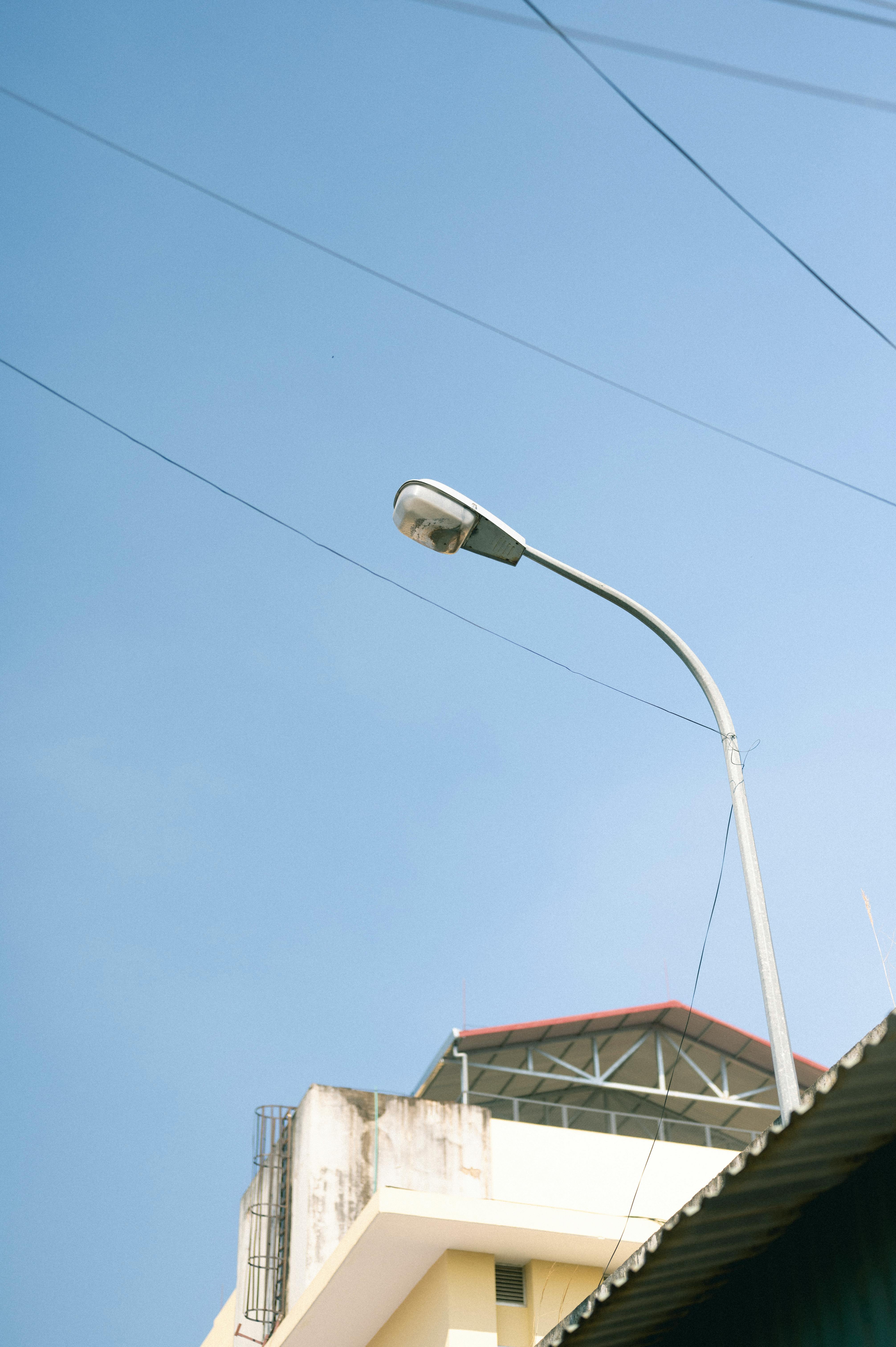 A street lamp stands tall against a clear blue sky in Lạng Sơn, Vietnam.