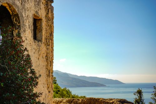 Free Explore the historic ruins in Kayaköy with a stunning view of the Mediterranean Sea. Stock Photo