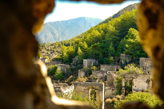 Explore the historic ruins of Kayaköy in the lush landscapes of Muğla, Türkiye.