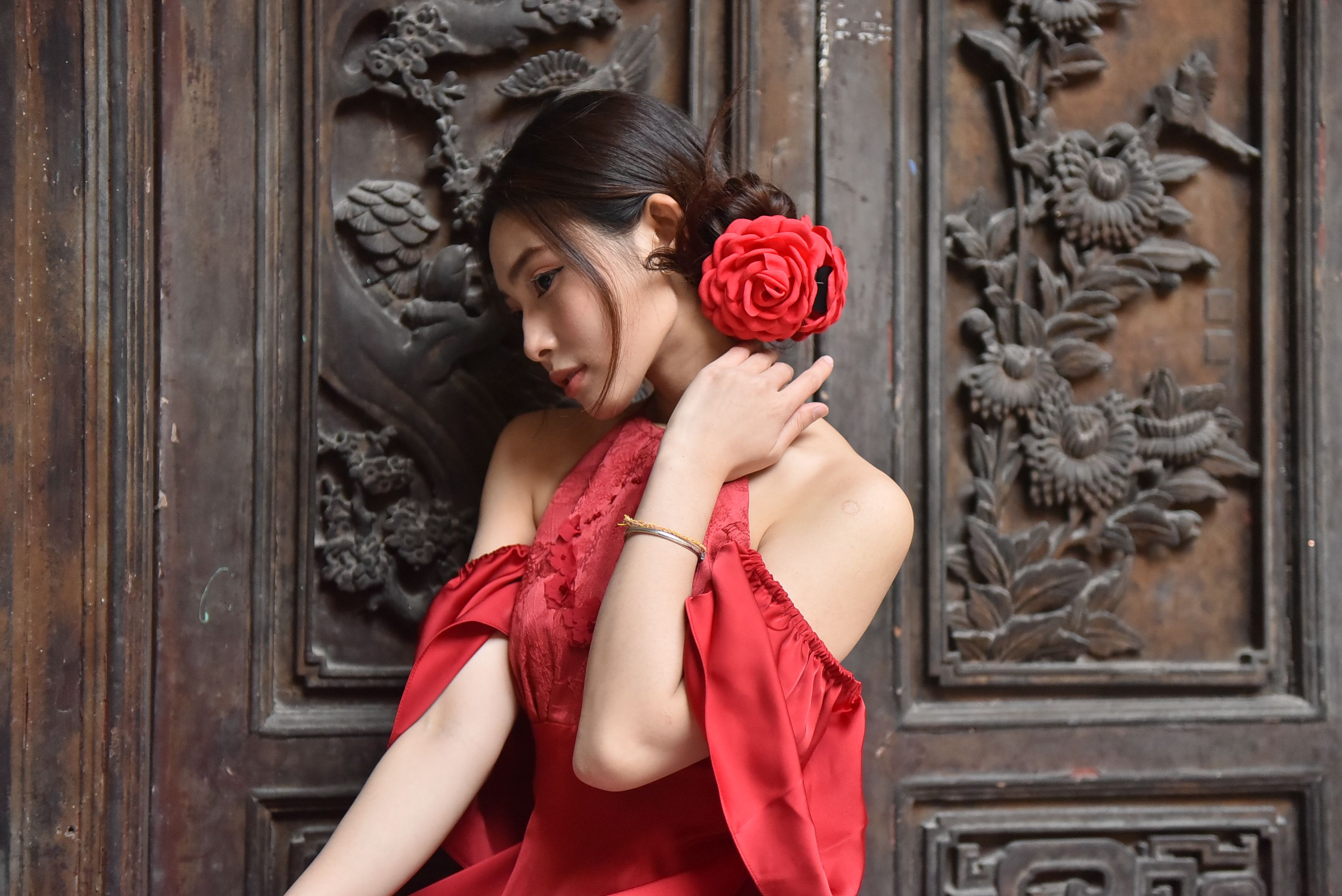 Elegant Woman in Red Dress with Floral Background · Free Stock Photo