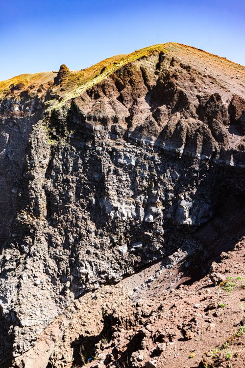 Free Captivating close-up of Mount Vesuvius's rugged crater under a clear blue sky in Campania, Italy. Stock Photo