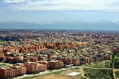 Marrakesh cityscape with the Atlas mountains beyond, photo by Moussa Idrissi on Pexels