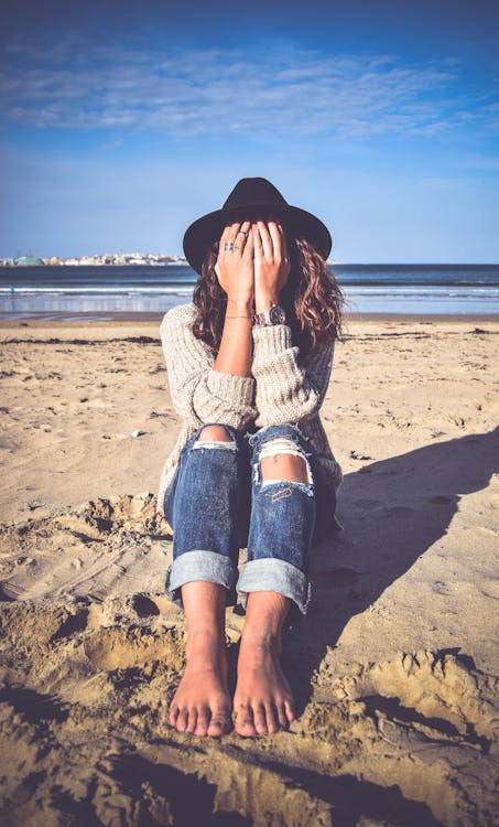 Woman Sitting on Sand