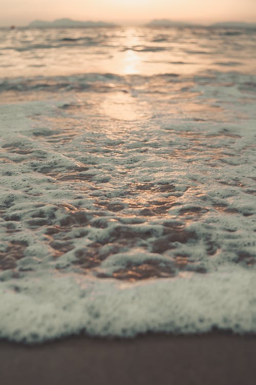 Low Angle Shot Of  Waves On The Shore