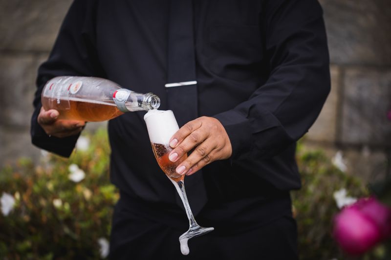 Rosé sparkling wine being poured into a flute — photo by Bruno Mattos on Pexels