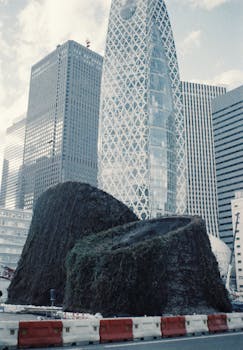 Street view of modern architecture in Tokyo featuring distinctive skyscrapers.
