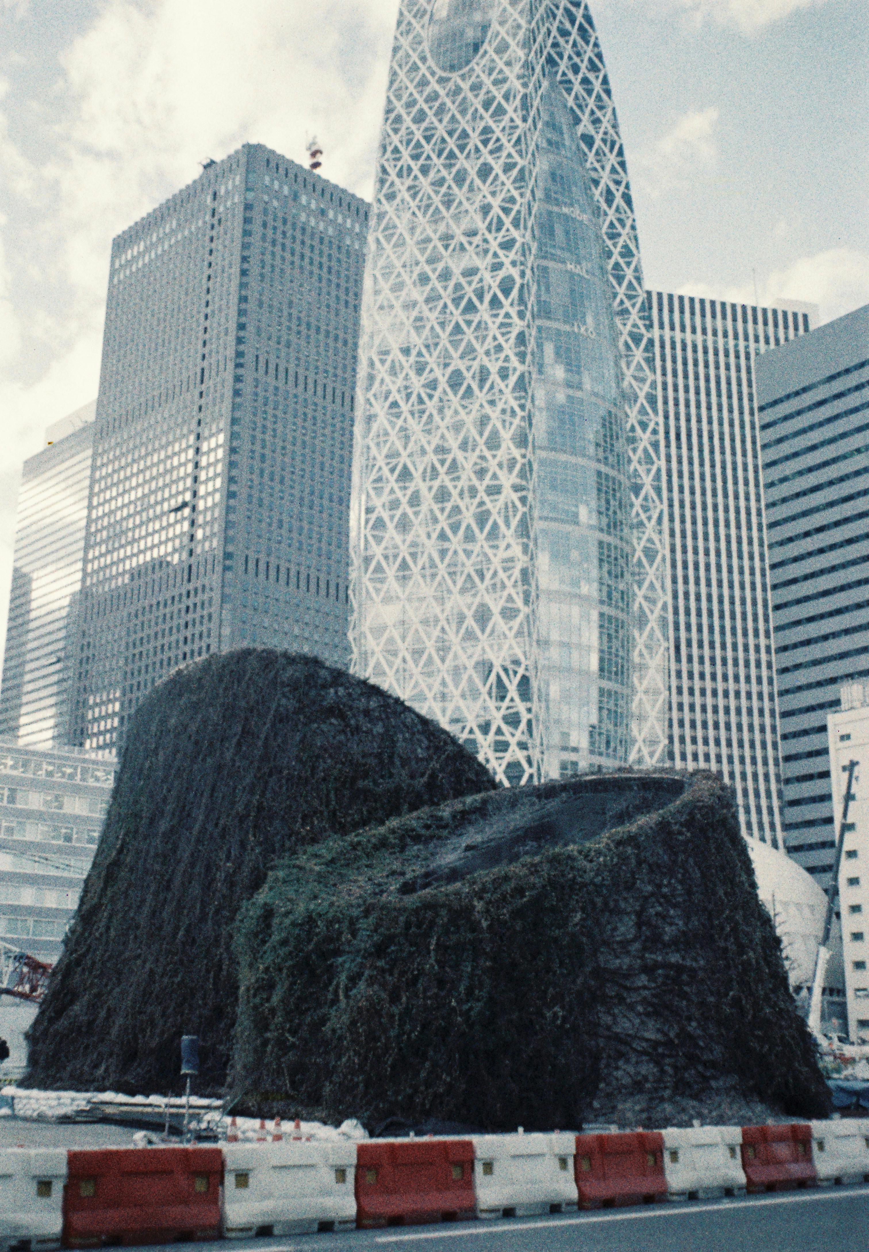 Free Street view of modern architecture in Tokyo featuring distinctive skyscrapers. Stock Photo