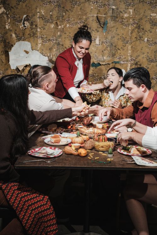 Free A diverse family enjoying a traditional Thanksgiving meal together indoors. Stock Photo