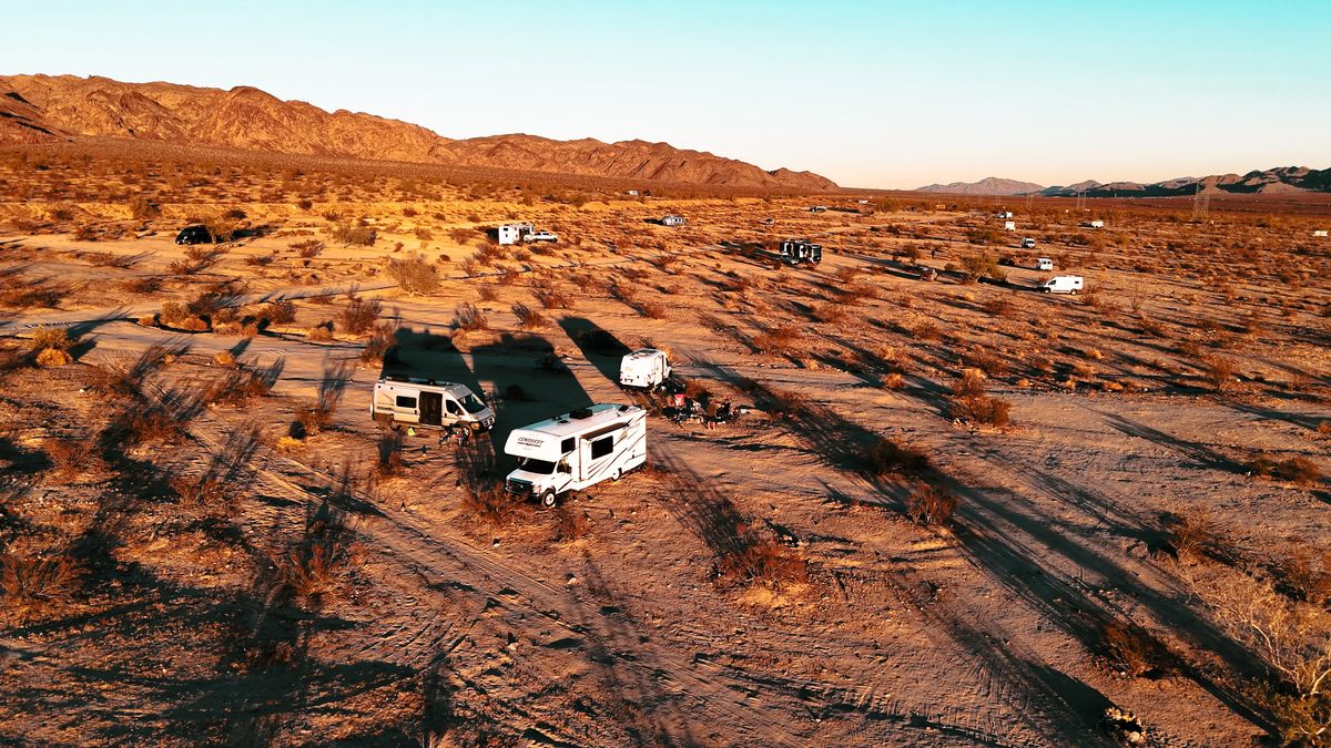 Aerial view of RVs camped across the desert