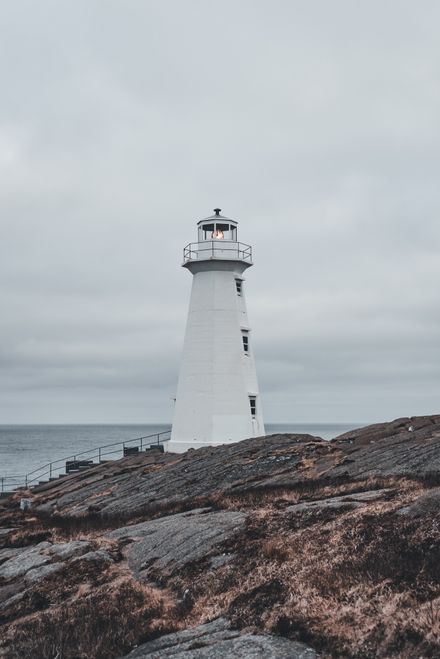 Light tower on a grey shore photo by Erik Mclean on Pexels