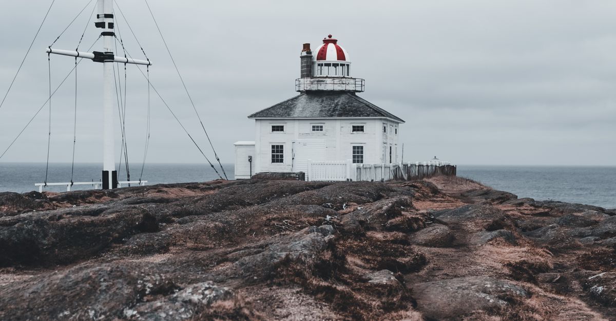 Remote Lighthouse Remote Coastal Lighthouse on Rocky Seashore · Free Stock Photo