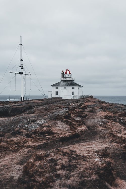 Remote Lighthouse Remote Coastal Lighthouse on Rocky Seashore · Free Stock Photo