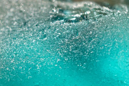 Free Macro shot of frost and texture on teal frosted glass, highlighting abstract patterns. Stock Photo