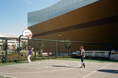 Photo Of Men Playing Basketball