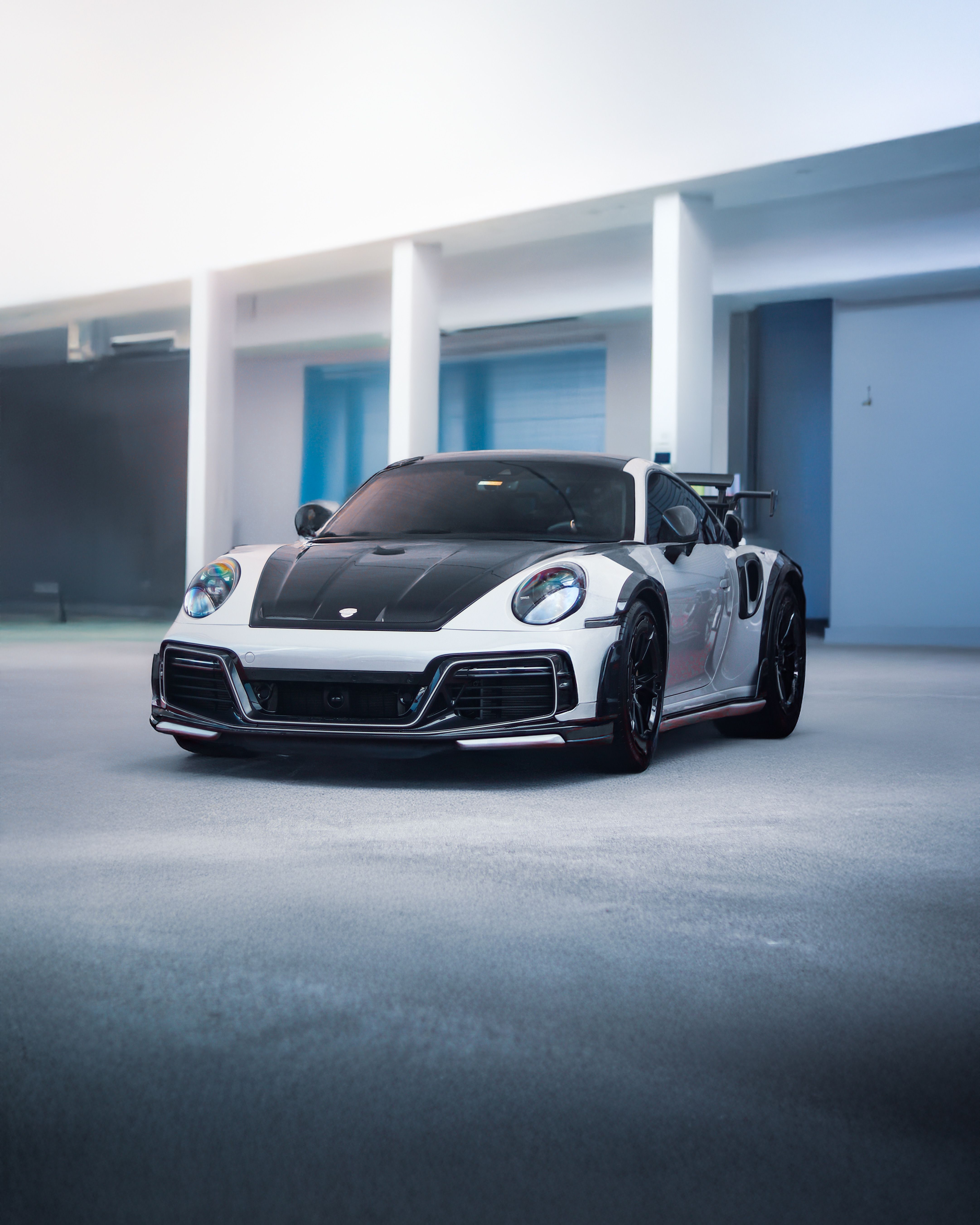 Sleek Sports Car In Modern Indoor Garage Free Stock Photo