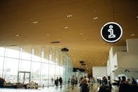 People Walking Inside Well-lit Building
