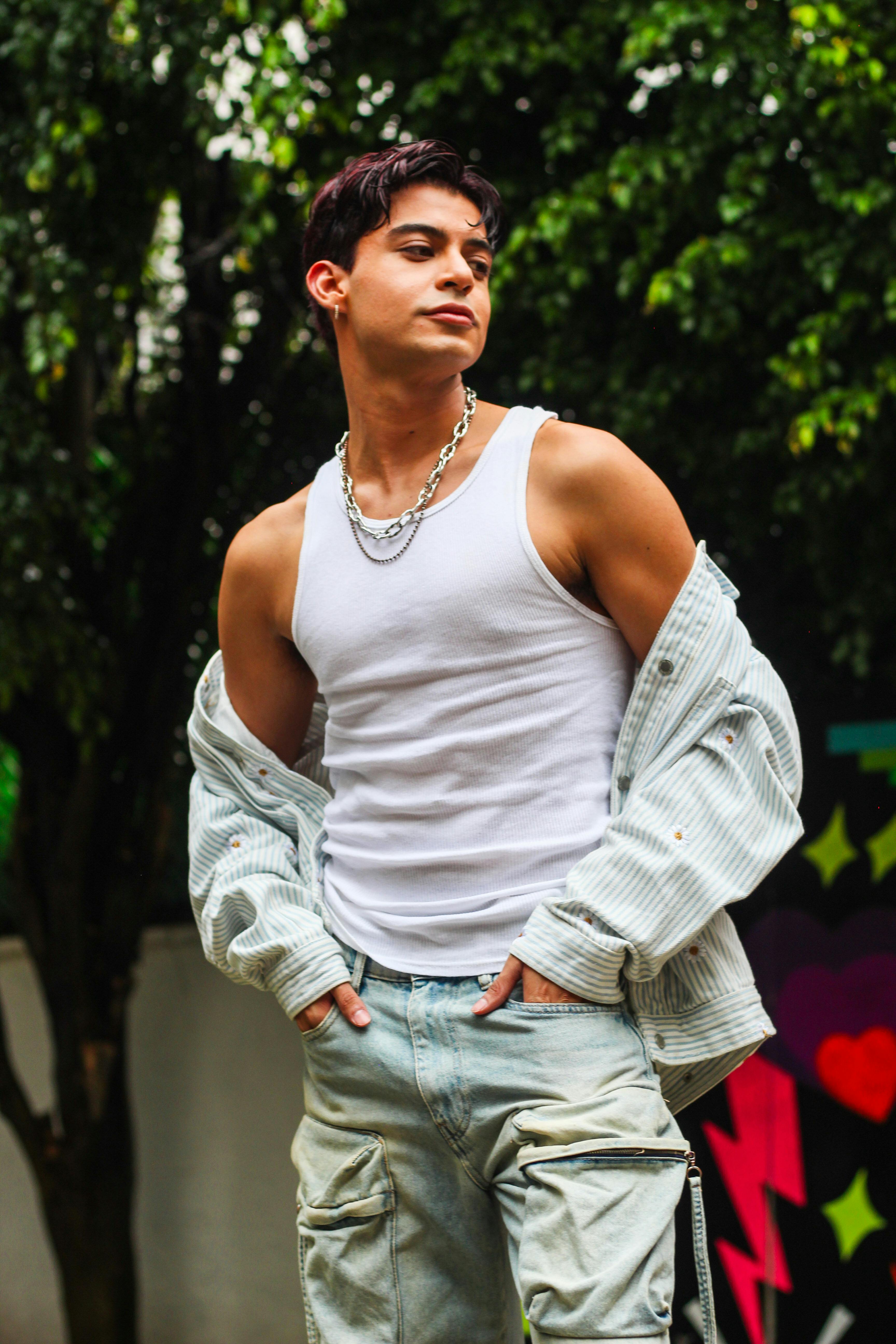 Stylish young man posing outdoors with a casual look.