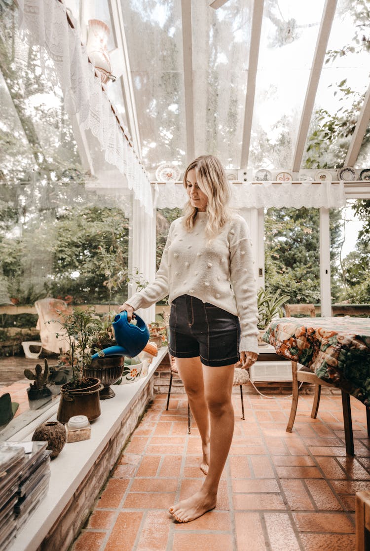 Photo Of Woman Watering Plants