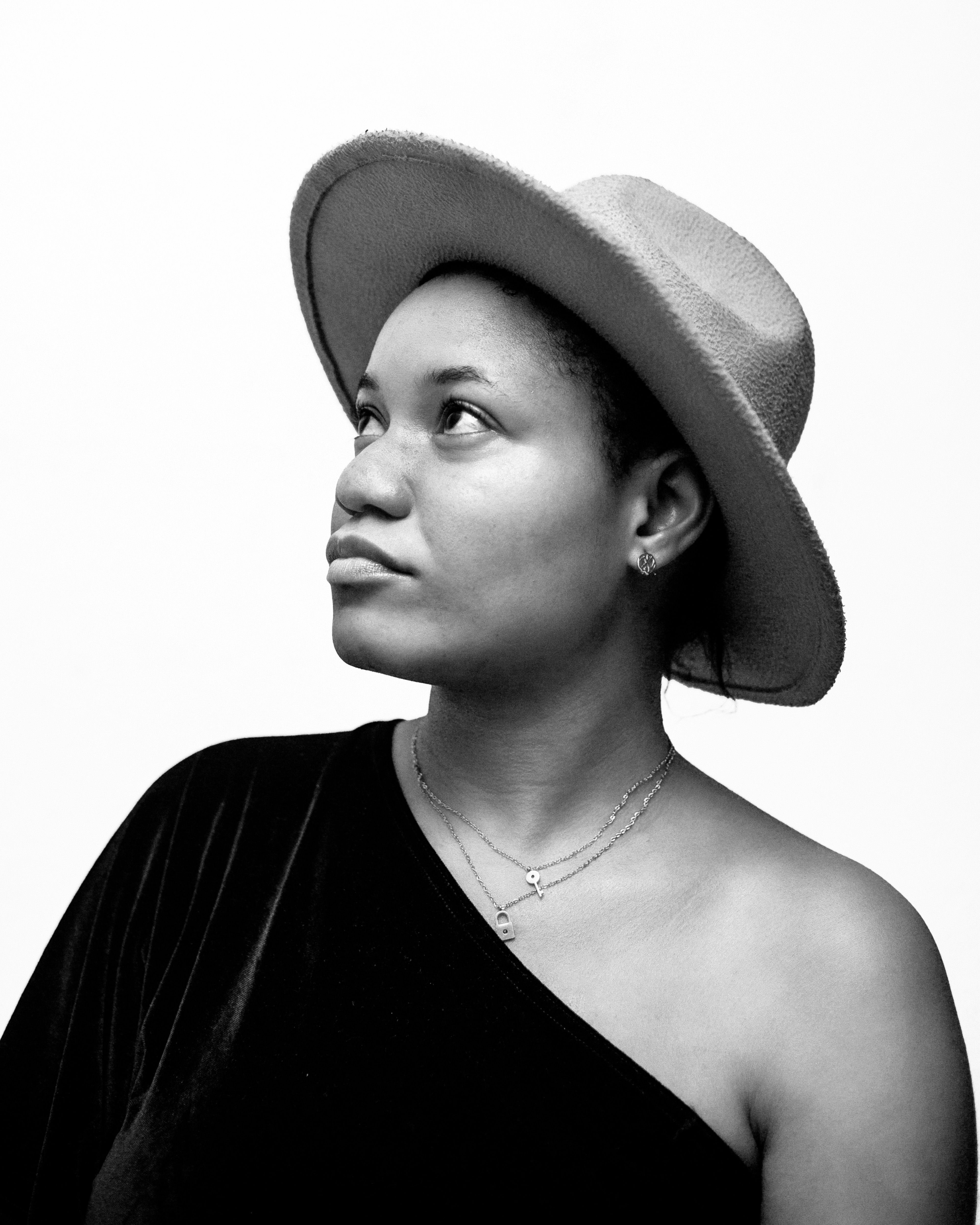 Elegant Black and White Portrait of Woman in Hat · Free Stock Photo