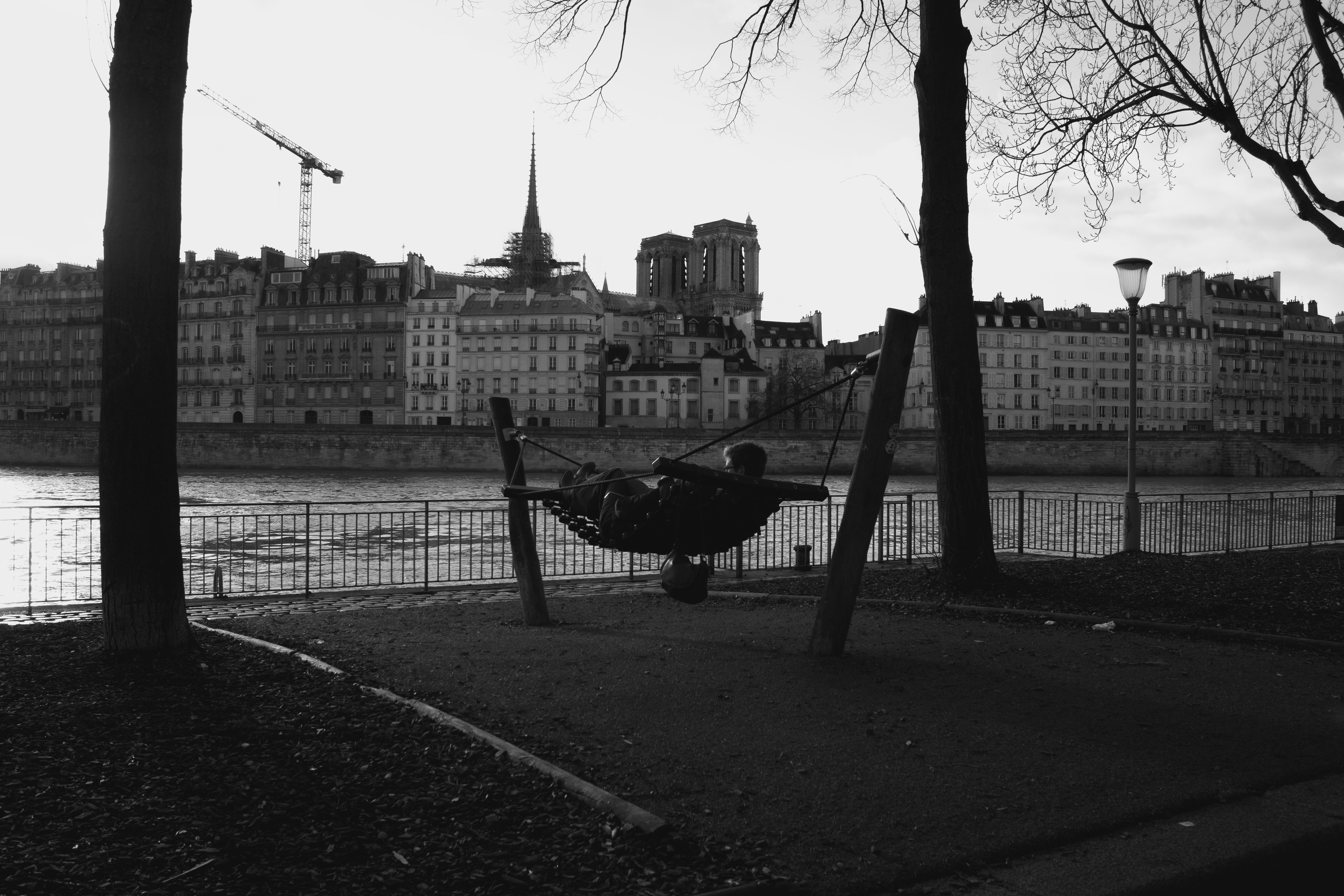 Serene Riverside Swing in Paris at Twilight · Free Stock Photo